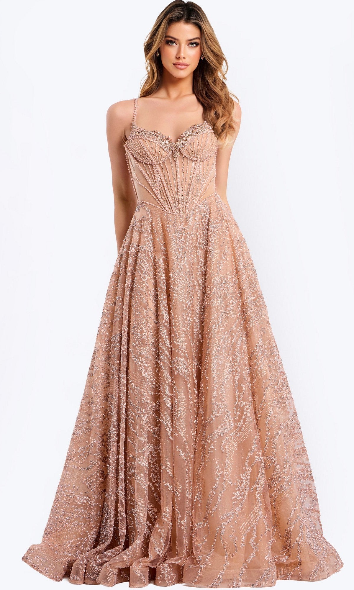 A woman stands facing forward in the Jovani 48365 long prom dress in rose/gold, featuring a floor-length beaded tulle skirt, thin straps, sparkling embellishments, and a sheer corset bodice against a plain background.